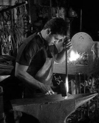 man welding in black and white