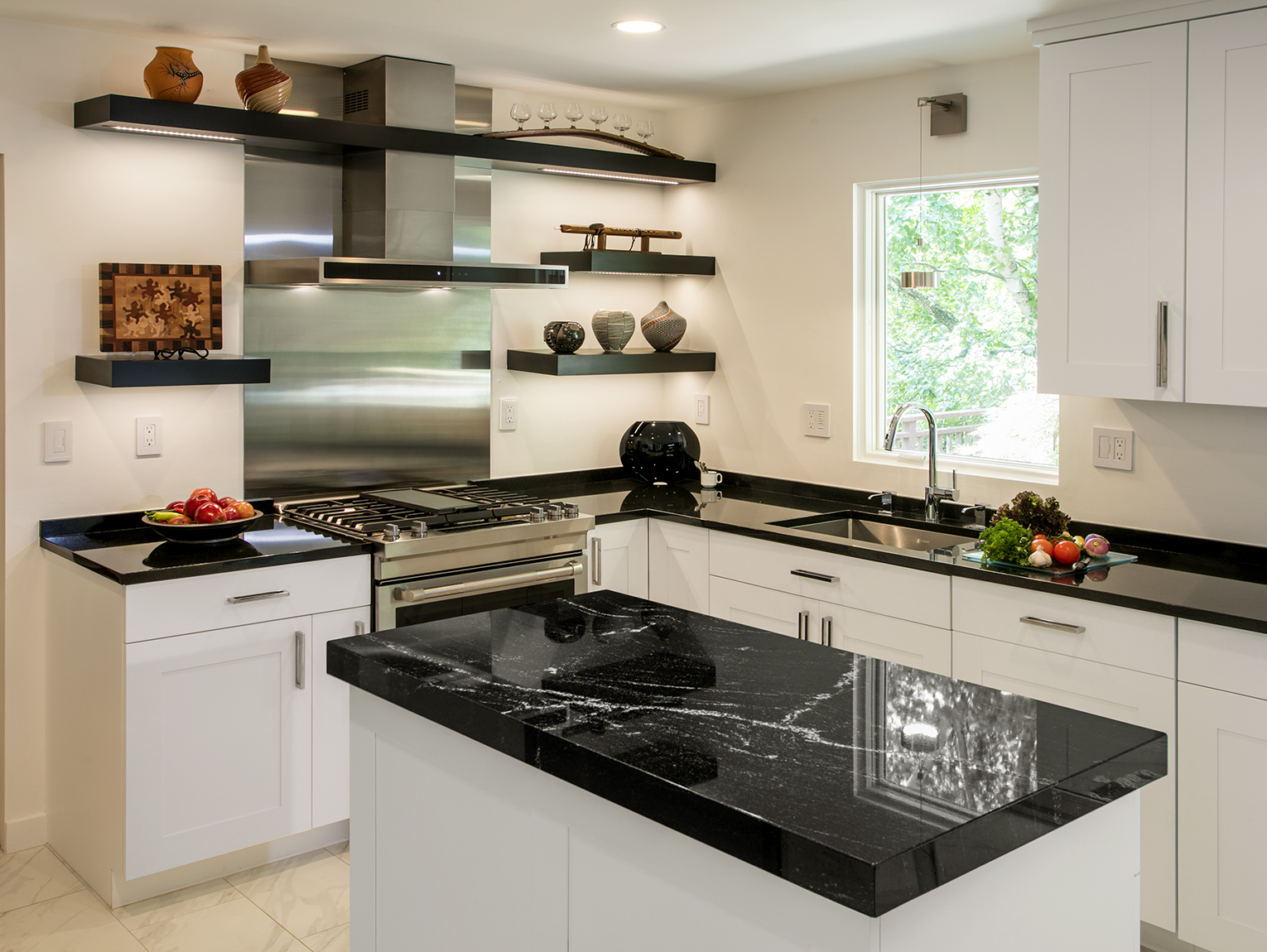 Contemporary Kitchen: black wooden shelving and black counters, white cabinetry